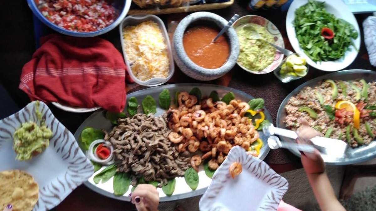 On-board buffet with shrimp, grilled beef, salsa, guacamole, salad and quinoa on a Puerto Vallarta yacht charter